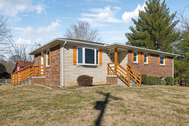 ranch-style home featuring stone siding, fence, a front lawn, and brick siding