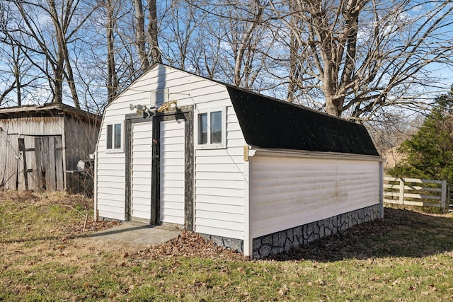 view of shed with fence