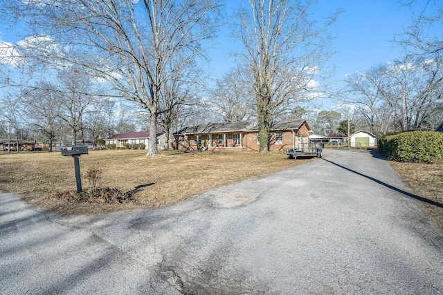 view of road with aphalt driveway