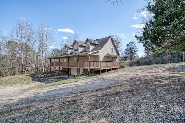 view of side of property featuring driveway