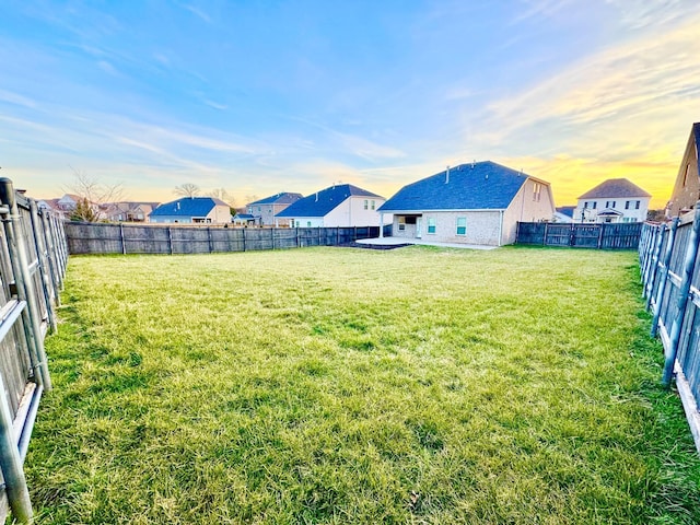 view of yard with a fenced backyard