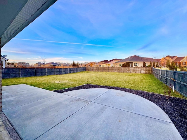 view of patio with a residential view and a fenced backyard