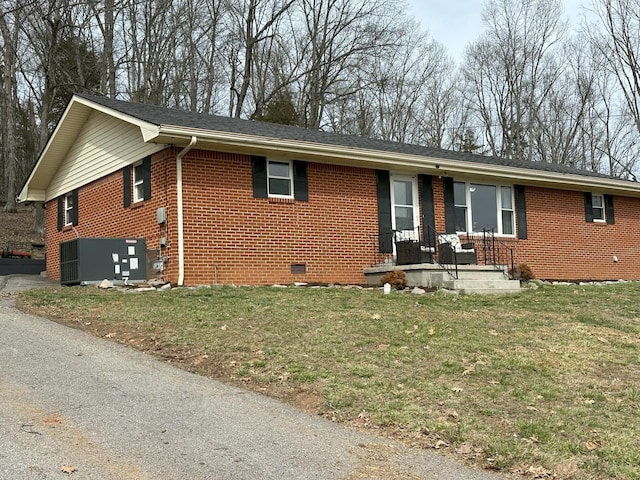 single story home featuring central AC, brick siding, crawl space, and a front lawn