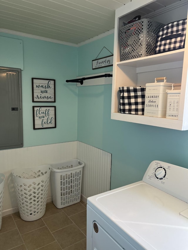 clothes washing area with laundry area, electric panel, wainscoting, washer / clothes dryer, and ornamental molding