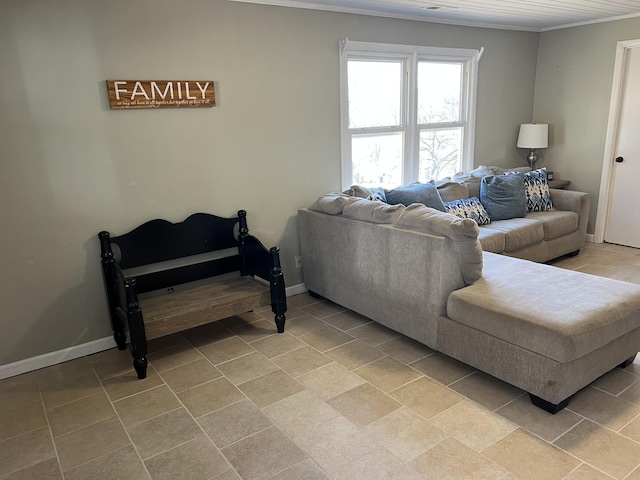 living room with baseboards and crown molding