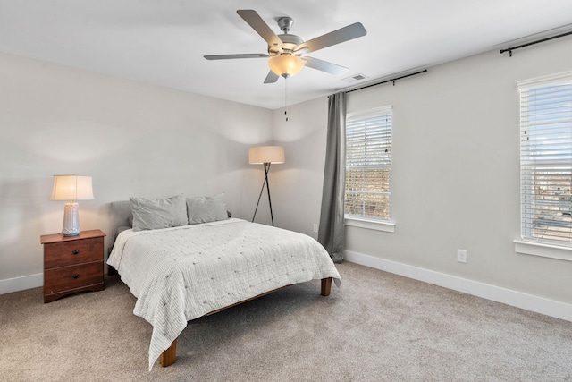 bedroom featuring a ceiling fan, carpet, visible vents, and baseboards