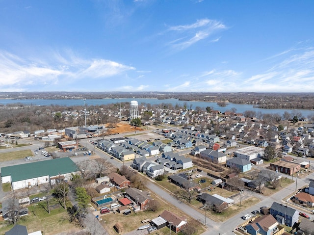 drone / aerial view with a water view and a residential view