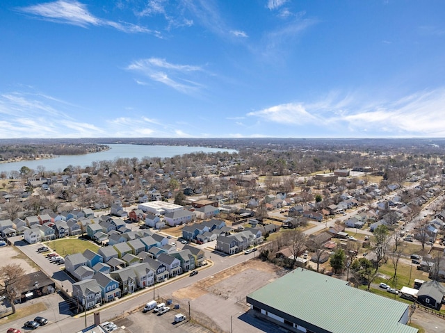 birds eye view of property featuring a residential view and a water view