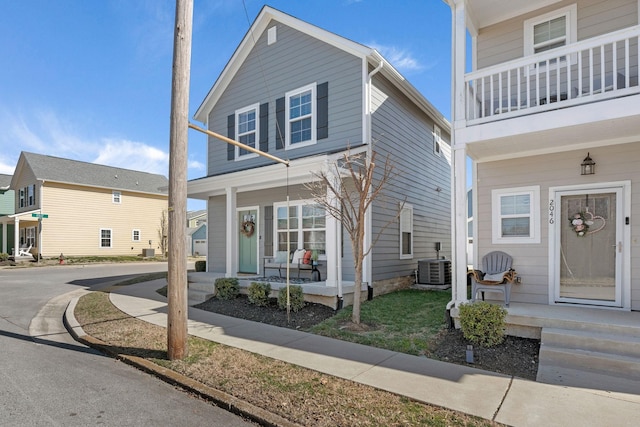 view of front of house featuring a porch and central air condition unit