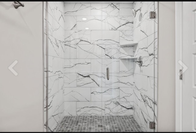 bathroom with a shower stall