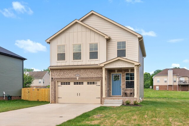 148 Cardinal Crk, Clarksville, TN 37040 - view of front facade featuring driveway, brick siding, an attached garage, and board and batten siding