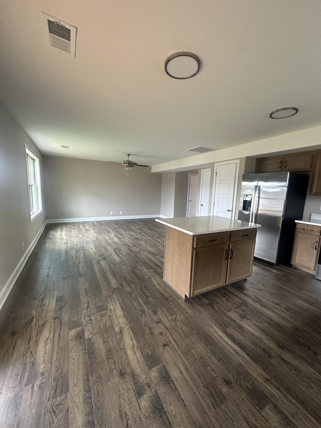 148 Cardinal Crk, Clarksville, TN 37040 - kitchen featuring stainless steel fridge, dark wood-type flooring, light countertops, and a center island