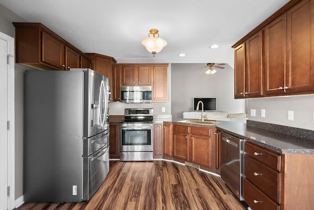 kitchen featuring recessed lighting, dark wood-style flooring, a sink, a ceiling fan, and appliances with stainless steel finishes