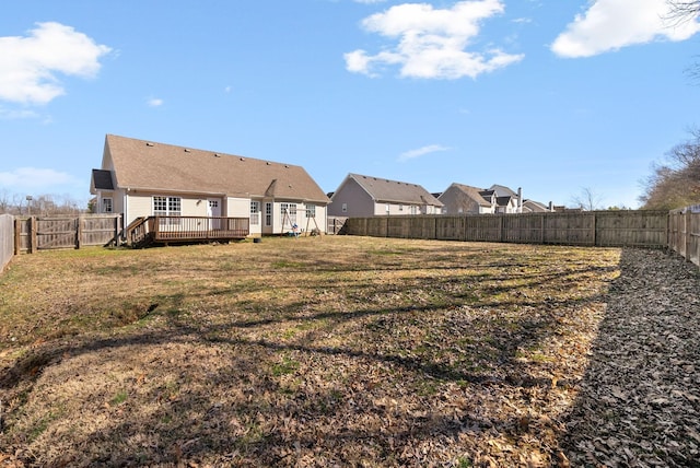 view of yard featuring a fenced backyard and a deck