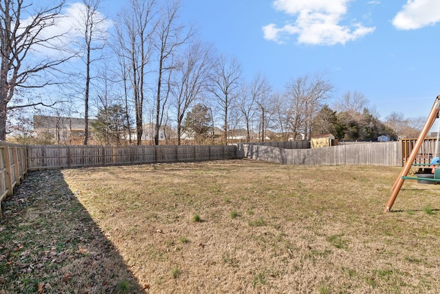 view of yard with a fenced backyard