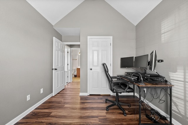 home office with high vaulted ceiling, wood finished floors, and baseboards