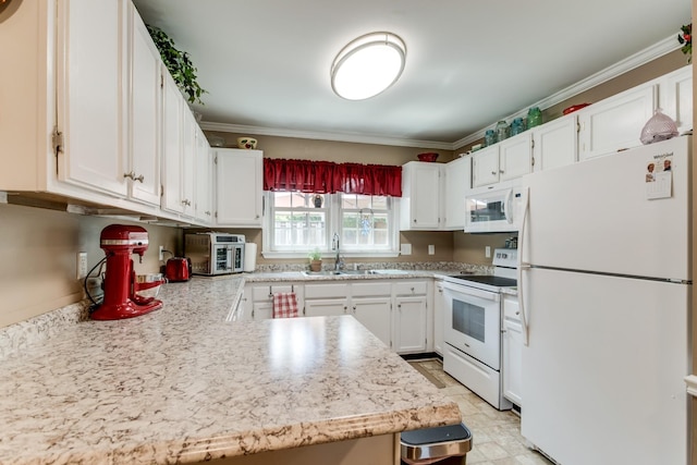 kitchen featuring ornamental molding, light countertops, white appliances, and a sink