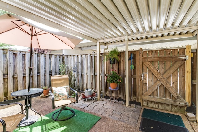 view of patio / terrace featuring fence