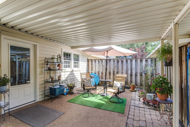 view of patio featuring fence