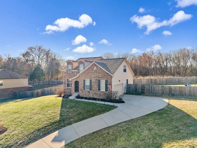 traditional home with driveway, fence, a front lawn, and brick siding