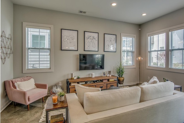 living room featuring visible vents and recessed lighting