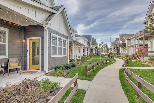 exterior space with a residential view and fence