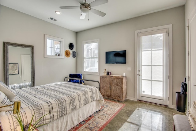 bedroom featuring a ceiling fan, visible vents, and baseboards