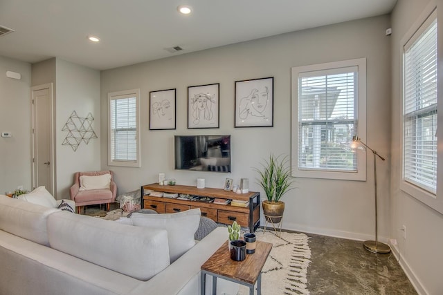 living room featuring recessed lighting, visible vents, and baseboards