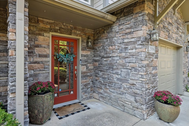 doorway to property featuring stone siding