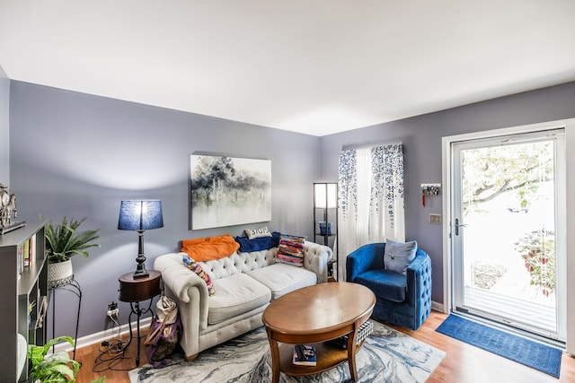 living room featuring light wood-style floors and baseboards