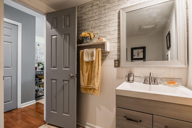 bathroom featuring wood finished floors and vanity