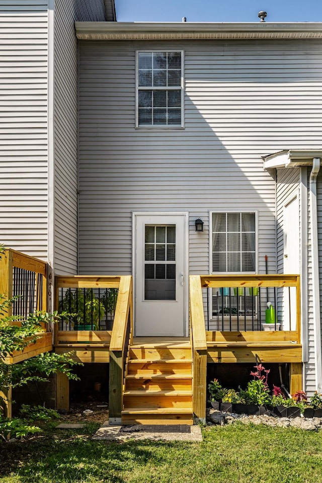 rear view of house with a wooden deck