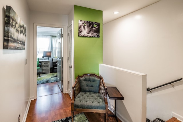 hallway with recessed lighting, baseboards, and wood finished floors