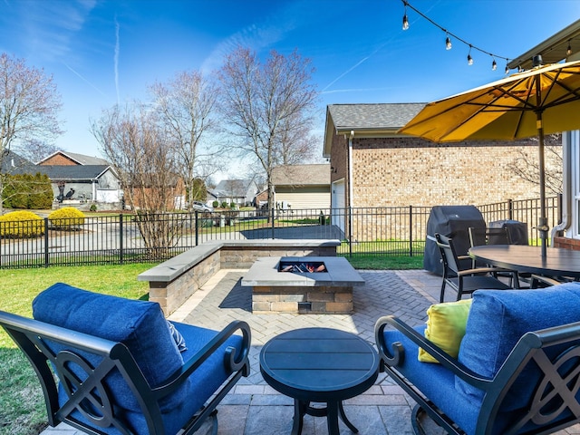 view of patio / terrace featuring outdoor dining space, a grill, fence, and an outdoor living space with a fire pit