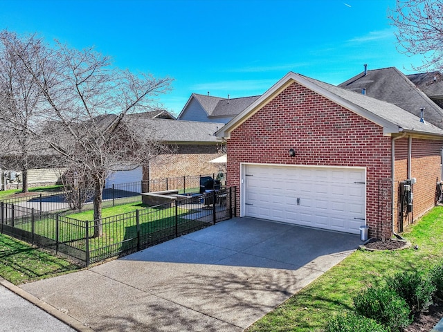 view of front facade with driveway, fence, a front lawn, and brick siding