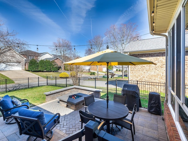 view of patio / terrace featuring outdoor dining space, a fenced backyard, a grill, and a fire pit