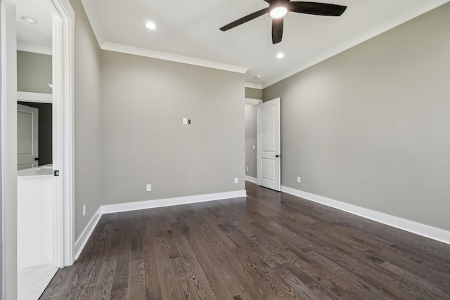 unfurnished room with baseboards, dark wood finished floors, and ornamental molding