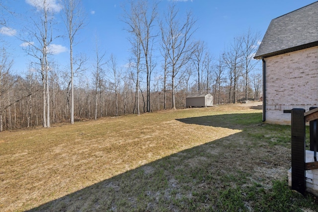 view of yard with an outbuilding and a shed