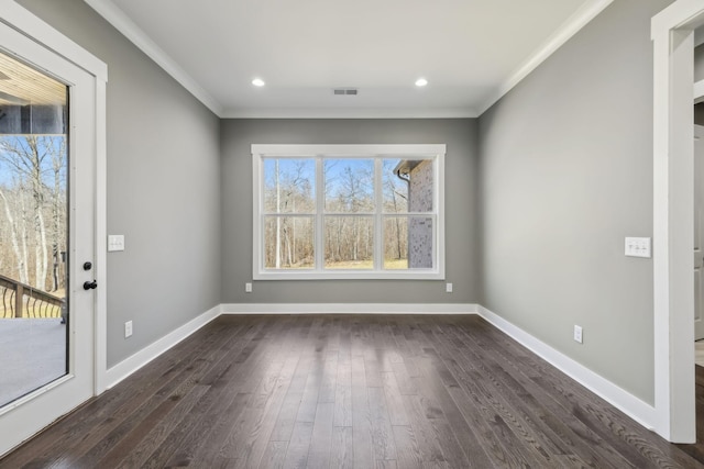 interior space featuring baseboards, visible vents, dark wood-type flooring, and crown molding