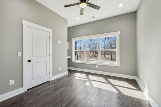 unfurnished bedroom with recessed lighting, dark wood finished floors, visible vents, and baseboards