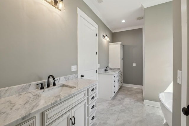 full bath with two vanities, a sink, visible vents, and baseboards