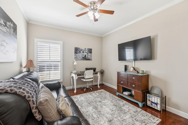 living area featuring dark wood-type flooring, crown molding, baseboards, and ceiling fan