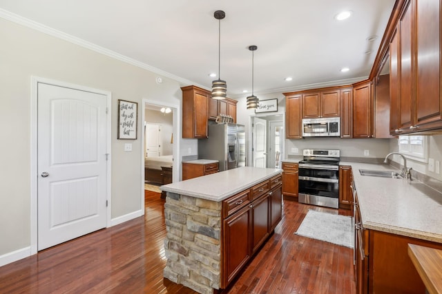 kitchen with a sink, ornamental molding, dark wood finished floors, and stainless steel appliances