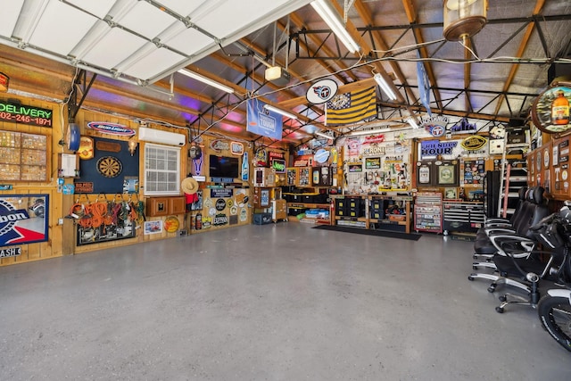 garage with a workshop area and a garage door opener