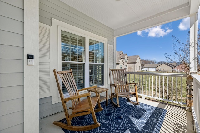 balcony with a residential view and covered porch