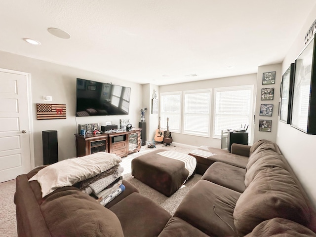 living room with carpet and baseboards