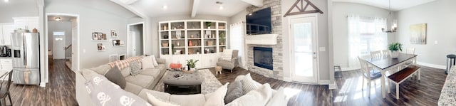 living room with vaulted ceiling with beams, baseboards, wood finished floors, and a stone fireplace