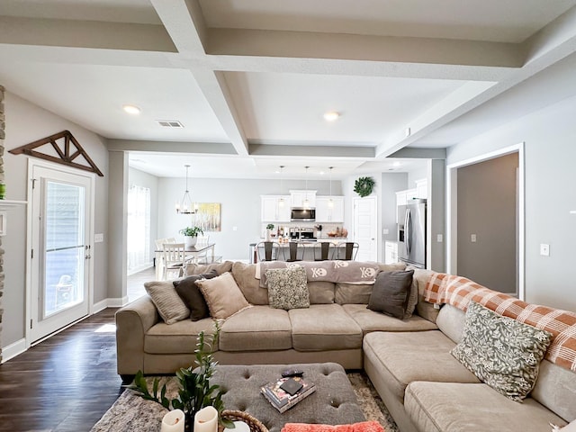 living area with dark wood-style floors, beam ceiling, visible vents, coffered ceiling, and baseboards