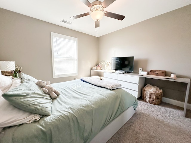 carpeted bedroom featuring visible vents, ceiling fan, and baseboards