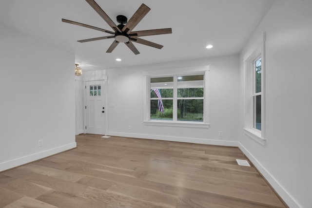 empty room featuring ceiling fan, recessed lighting, visible vents, baseboards, and light wood-style floors